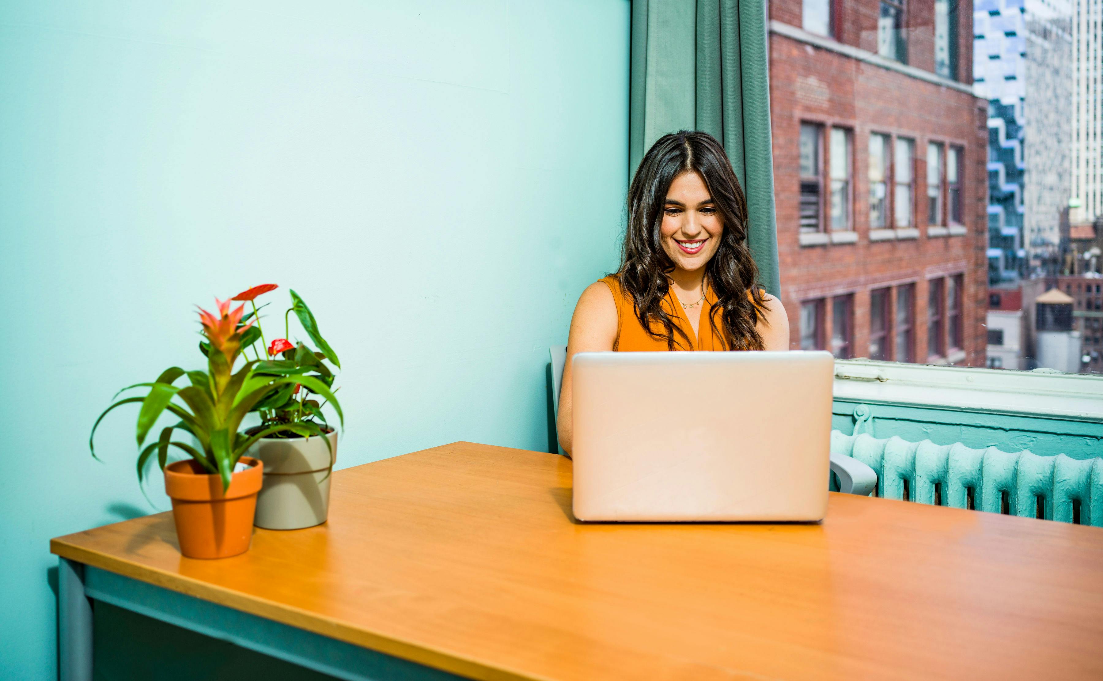 woman-sitting-in-front-of-the-laptop