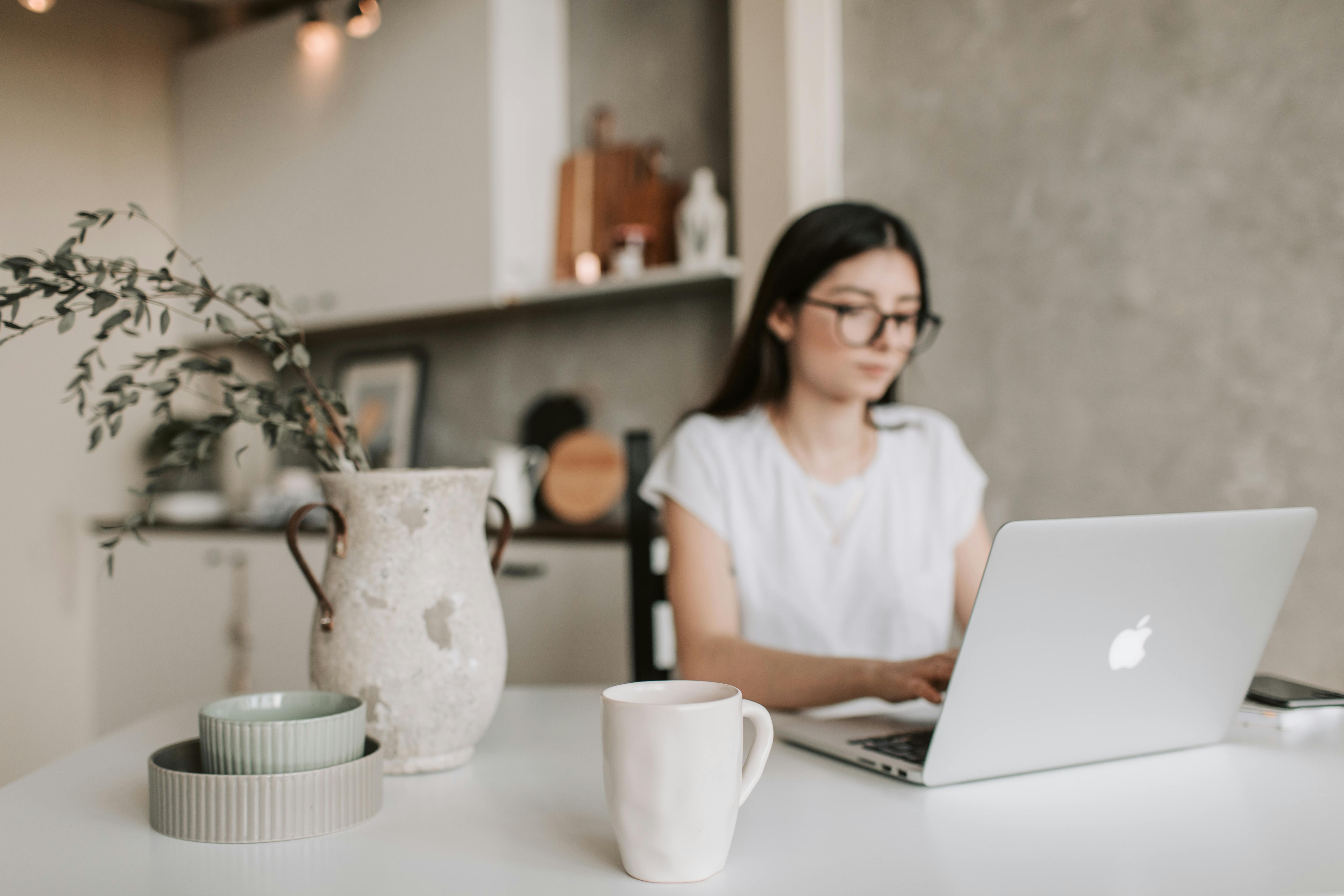 focused-young-businesswoman-working-remotely-at-home