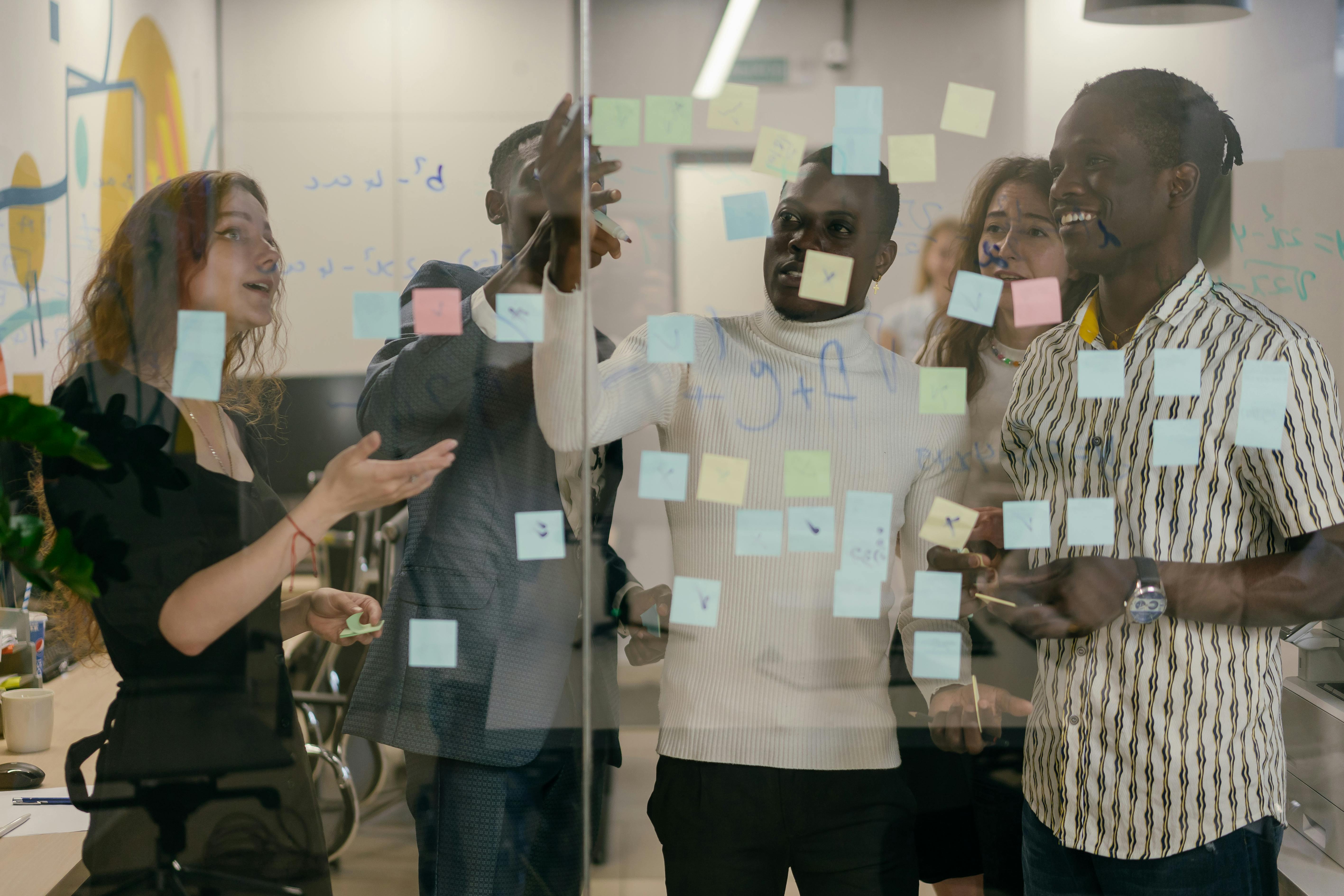 colleagues-looking-at-sticky-notes